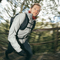 Ridge - Man hiking through a forest with a blurred background